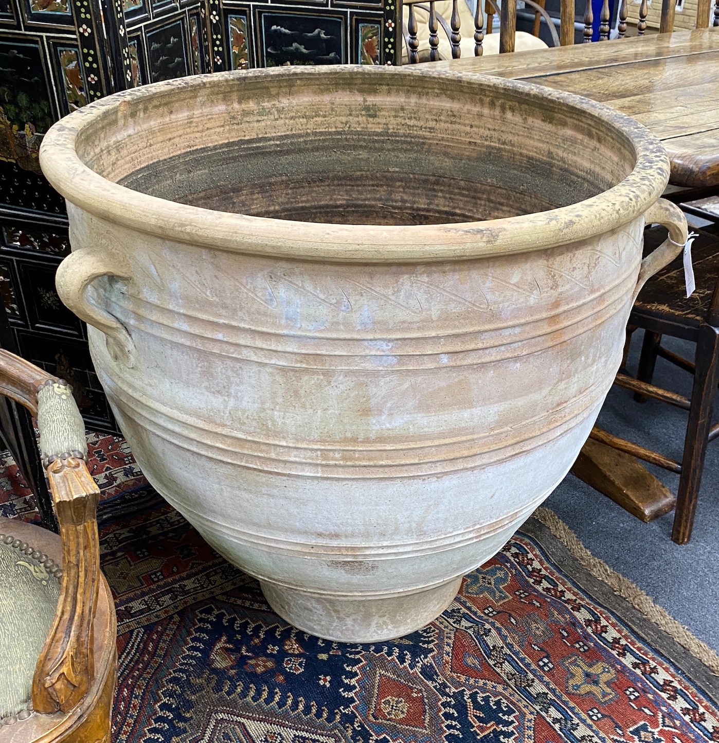 A large Grecian style circular earthenware garden planter diameter 80cm, height 80cm